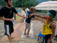 Backpackers Tubing on the Nam Song river in Vang Vieng, Laos - Mar 2011