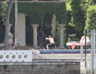 Alicia Keys enjoys some pool fun with her son Egypt and family. Alicia also got cuddles and kisses as she took some time out ahead of the Zo's Summer Groove this weekend
