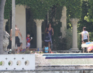 Alicia Keys enjoys some pool fun with her son Egypt and family. Alicia also got cuddles and kisses as she took some time out ahead of the Zo's Summer Groove this weekend
