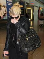 AN EMOTIONAL KELLY OSBOURNE AT HEATHROW