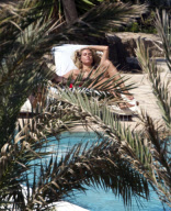 Heidi Klum enjoy a day at the swimming pool in sunny Ibiza