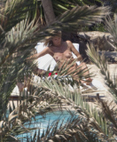 Heidi Klum enjoy a day at the swimming pool in sunny Ibiza