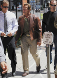 Arnold Schwarzenegger leaving Toscana