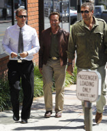 Arnold Schwarzenegger leaving Toscana