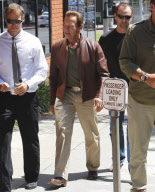 Arnold Schwarzenegger leaving Toscana