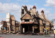 Riots rage across England