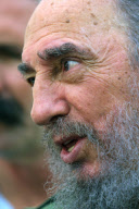 Fidel Castro talks to the press after casting his vote at state elections
