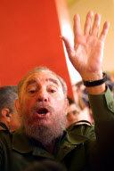Fidel Castro raises a hand after elections in Cuba