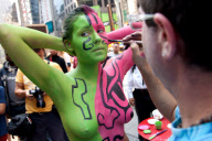 Andy Golub paints nude model in Times Square, New York, America - 19 Aug 2011