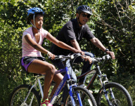 Obama biking with daughter Malia