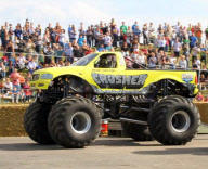Stunt driver's attempt to drive monster truck over fire engine backfires at Santa Pod Raceway, Northamptonshire, Britain - 21 Aug 2011