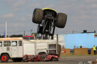 Stunt driver's attempt to drive monster truck over fire engine backfires at Santa Pod Raceway, Northamptonshire, Britain - 21 Aug 2011