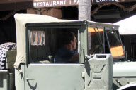 Arnold Schwarzenegger Drives his Military Vehicle Around Town