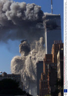 Smoke And Debris Erupt From The South Tower Of The World Trade Center As It Explodes After Two Jets Crashed Into The Buildings Tuesday Sept. 21 2001 In New York. Terrorists Crashed Two Airliners Into The World Trade Center In A Closely Timed Series O