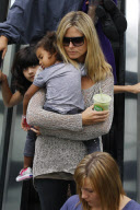 Heidi Klum carries her baby Lou