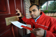 Postmen to be issued with 'Posting Pegs' to avoid getting their fingers bitten by dogs, Britain - 17 Sep 2011
