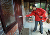 Postmen to be issued with 'Posting Pegs' to avoid getting their fingers bitten by dogs, Britain - 17 Sep 2011