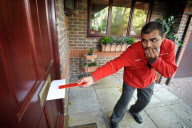 Postmen to be issued with 'Posting Pegs' to avoid getting their fingers bitten by dogs, Britain - 17 Sep 2011