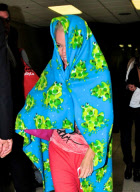 Kendra Wilkinson Hides Under a Frog Blanket