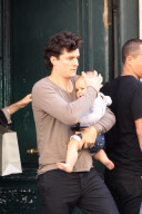 Miranda Kerr, Orlando Bloom and their baby boy Flynn strolling in Paris during Paris Fashion week