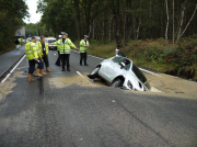 Car Swallowed by Gaping Hole in Road Caused by a Burst Water Main, Surrey, Britain - 05 Oct 2011