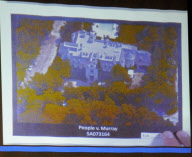 A photograph from the coroner of Michael Jackson's body is projected by the prosecution
