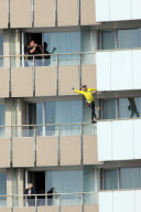 Alain 'Spiderman' Robert scales the Hotel Intercontinental in Bucharest, Romania - 14 Oct 2011