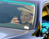 EXCLUSIVE Ashton Kutcher wearing wedding as he texts and drives