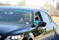 EXCLUSIVE Ashton Kutcher wearing wedding as he texts and drives
