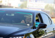 EXCLUSIVE Ashton Kutcher wearing wedding as he texts and drives
