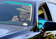 EXCLUSIVE Ashton Kutcher wearing wedding as he texts and drives