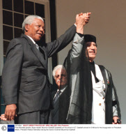 Pres Mandela greets Libyan leader Muamar Qaddafi (Gaddafi) on his arrival in CT. Qaddafi arrived in S Africa for the inauguration of President Mbeki.