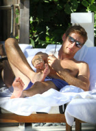 Formula One Driver Jenson Button Lounges Poolside in Miami