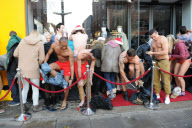 World record attempt for the World's longest swimwear queue, Virgin Holidays store, London, Britain - 13 Dec 2011