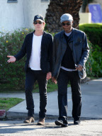 Kevin Bacon Dresses in Dark Clothes on a Sunny Day