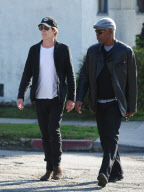 Kevin Bacon Dresses in Dark Clothes on a Sunny Day
