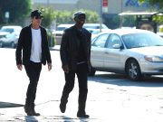 Kevin Bacon Dresses in Dark Clothes on a Sunny Day