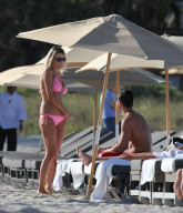 51 year old actress Rita Rusic shows she still has a great beach body to rival ladies twenty years her junior..The movie producer got her necklace tangled up but her boyfriend came to her rescue and straightened it out for her. Miami Beach Fl 