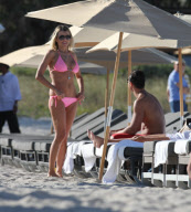 51 year old actress Rita Rusic shows she still has a great beach body to rival ladies twenty years her junior..The movie producer got her necklace tangled up but her boyfriend came to her rescue and straightened it out for her. Miami Beach Fl 