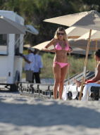 51 year old actress Rita Rusic shows she still has a great beach body to rival ladies twenty years her junior..The movie producer got her necklace tangled up but her boyfriend came to her rescue and straightened it out for her. Miami Beach Fl 