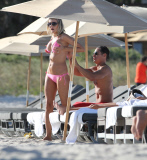 51 year old actress Rita Rusic shows she still has a great beach body to rival ladies twenty years her junior..The movie producer got her necklace tangled up but her boyfriend came to her rescue and straightened it out for her. Miami Beach Fl 