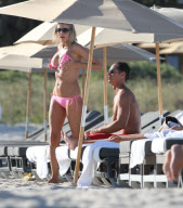 51 year old actress Rita Rusic shows she still has a great beach body to rival ladies twenty years her junior..The movie producer got her necklace tangled up but her boyfriend came to her rescue and straightened it out for her. Miami Beach Fl 
