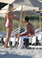 51 year old actress Rita Rusic shows she still has a great beach body to rival ladies twenty years her junior..The movie producer got her necklace tangled up but her boyfriend came to her rescue and straightened it out for her. Miami Beach Fl 