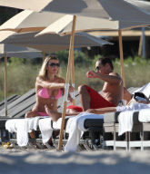51 year old actress Rita Rusic shows she still has a great beach body to rival ladies twenty years her junior..The movie producer got her necklace tangled up but her boyfriend came to her rescue and straightened it out for her. Miami Beach Fl 