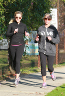 Actress REESE WITHERSPOON out jogging with a friend in Brentwood