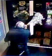 Mop-wielding shopkeeper fends off three armed robbers, Rushden, Northants, Britain - 24 Jan 2012