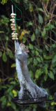 Squirrel attempts to eat hanging peanut kebab, Fareham, Hampshire, Britain - Dec 2012
