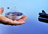 Photographer captures exact moment pellet fired from an airgun speeds through water drop, America - Feb 2012