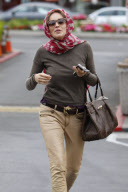 SHARON STONE goes Grace-Kelly-style as she hides her hair with a scarf 