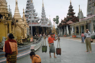A tourist takes photographs in the Shwedagon, the most revered and famous pagoda of Rangoon in Yangon, Myanmar (Burma) - 2008